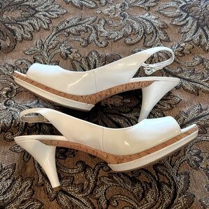 Nine West while heels.  Size 7.5